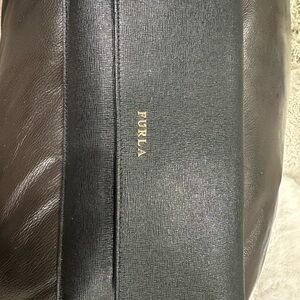 Black leather clutch or wallet. Lots of pockets 7 in total!